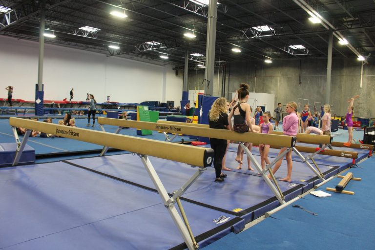 Kids in a gymnastics balance beam class at High Altitude Tumbling in Provo
